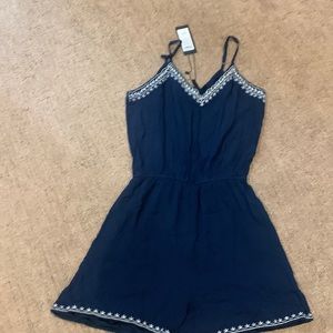 Cute summer short jump suit. Brand new. Lining adjustable straps. Elegant/fun